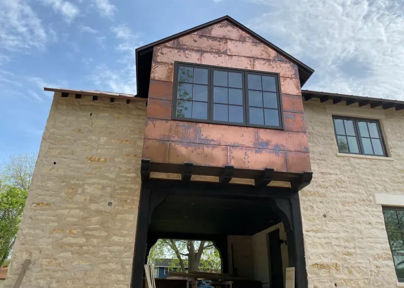Copper metal panel facade on a stone building for Skylight Installation in Laguna Niguel