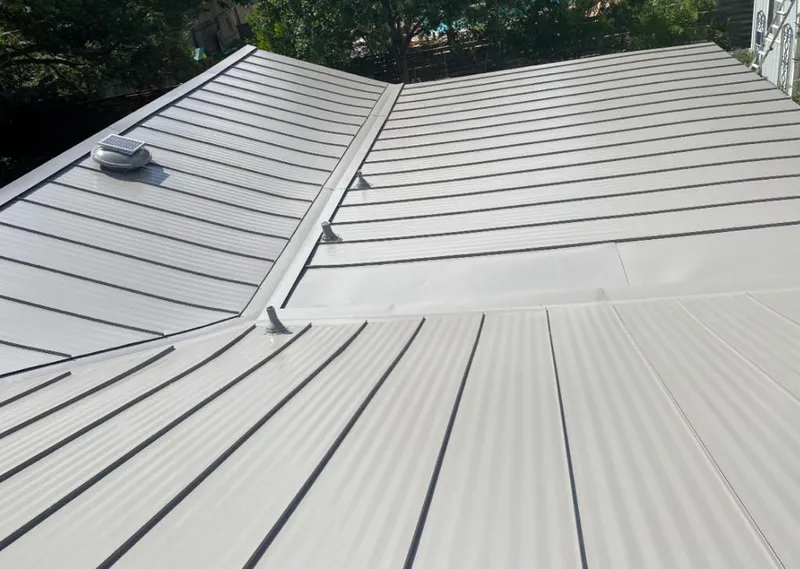Solar attic fan installed on a metal roof for Roof Ventilation in Laguna Niguel